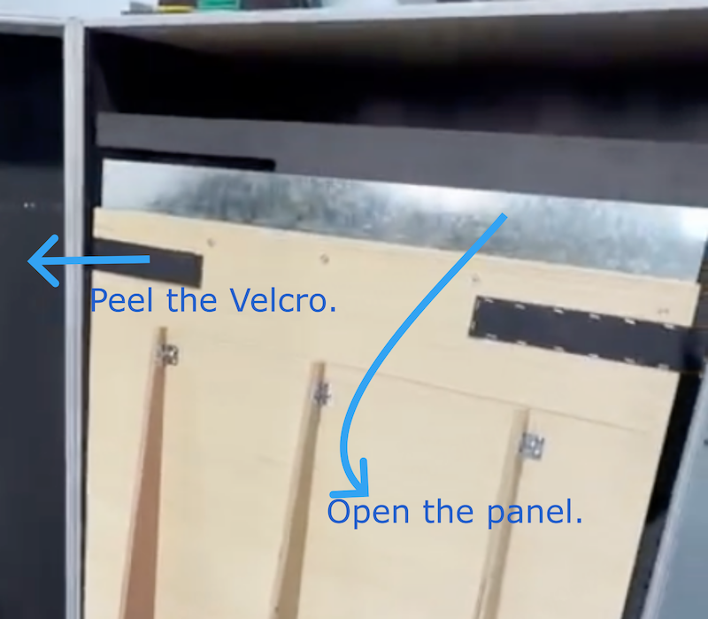 Secure the wheels of the flight case and open the panel to slide the robot out.